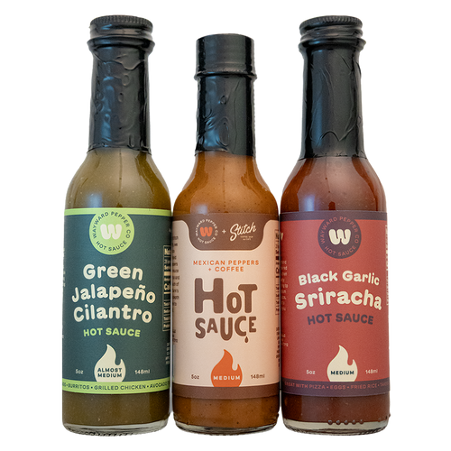 Trust Me Bundle: Green Jalapeño Cilantro, Mexican Peppers & Coffee, and Black Garlic Sriracha hot sauce bottles side by side