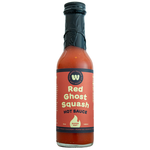 A bottle of Red Ghost Squash Hot Sauce from Wayward Pepper Company on a transparent background