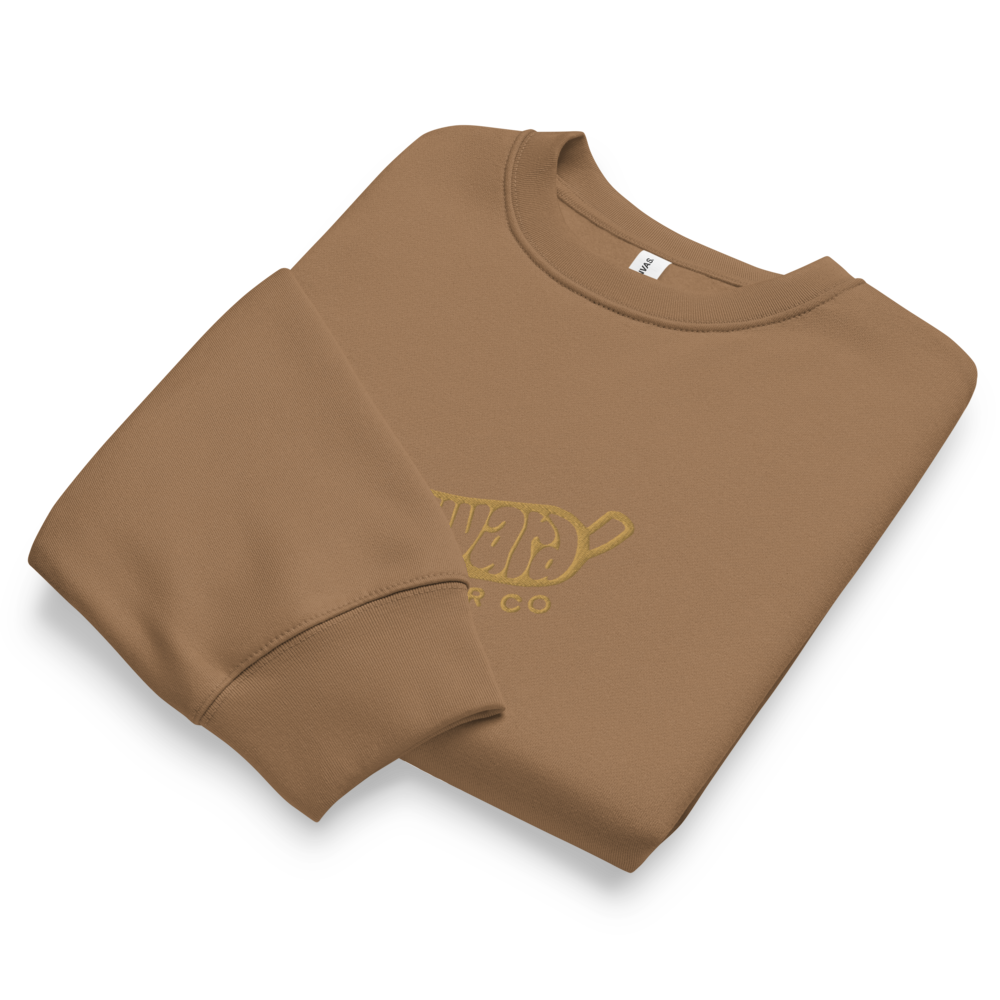 Wayward Embroidered Crewneck in Vintage Brown, folded, showing the gold embroidered logo